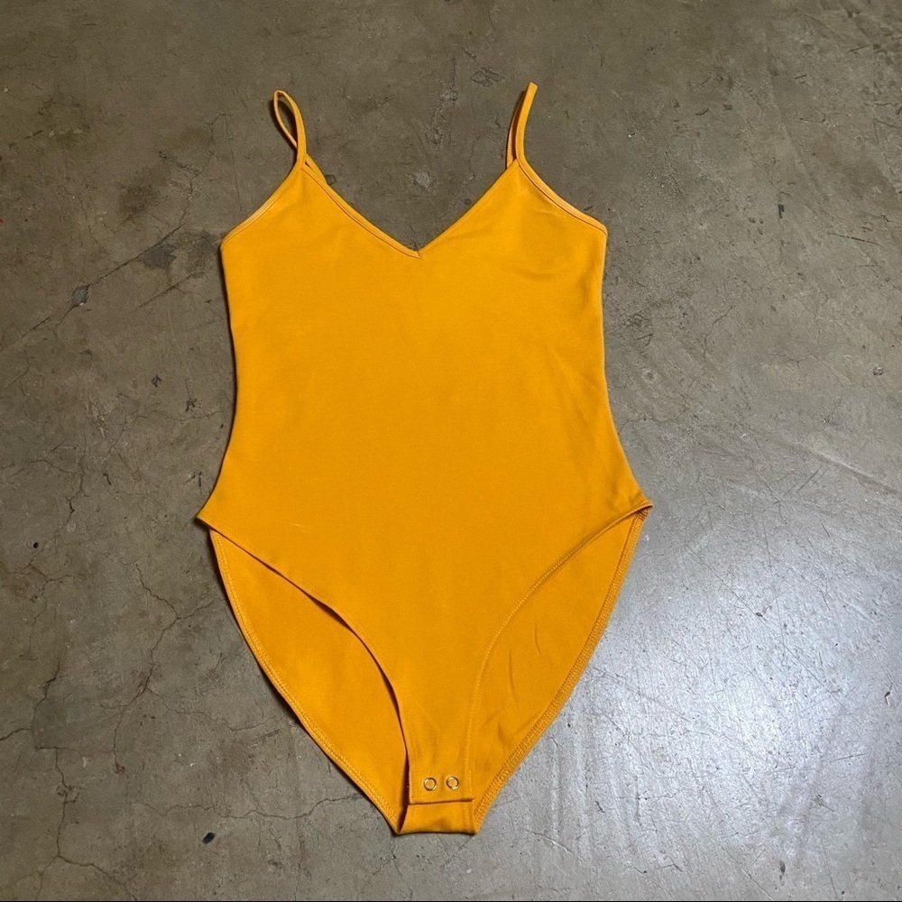 Neon orange bodysuit with bottom clasp